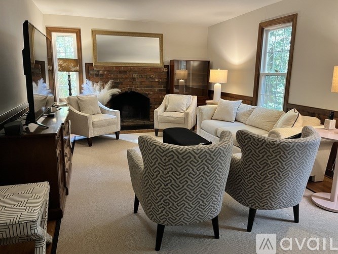 A living room with a fireplace and a couch.