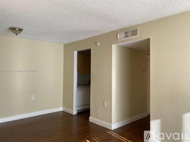 A room with a washer and dryer in it.