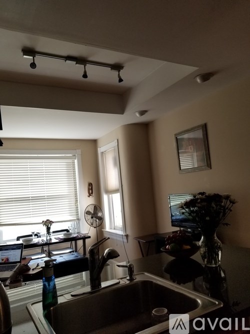 A kitchen with a sink and a window.