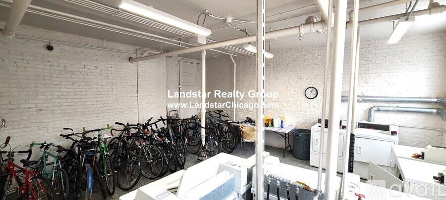 A room with a white brick wall and a clock on the wall.