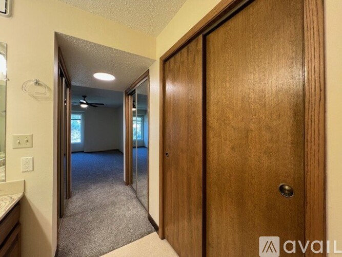 A wooden door is on the right side of the image.