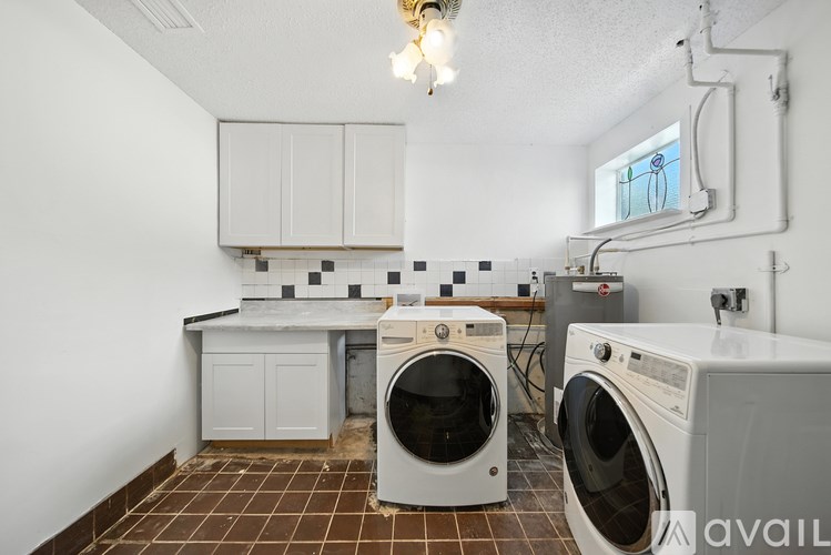 A laundry room with a washer and dryer.