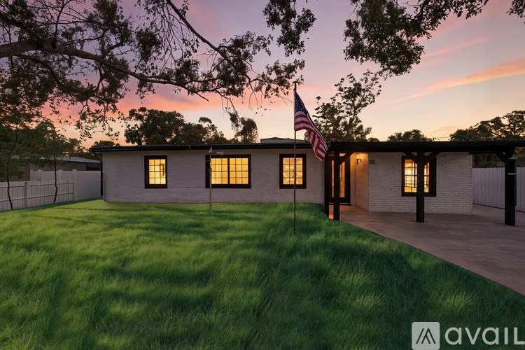 A house with a flag on a pole in front of it.