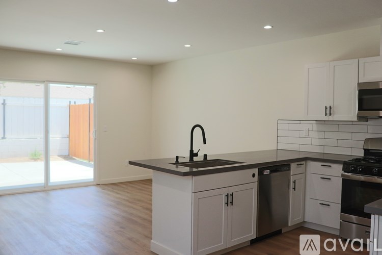 A kitchen with a sink and cabinets.