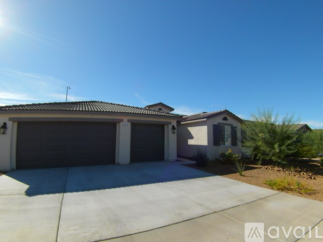 A house with a garage is available for sale.