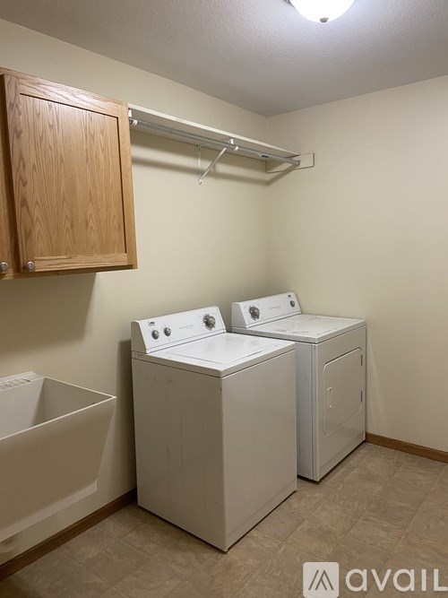 A laundry room with a washer and dryer.