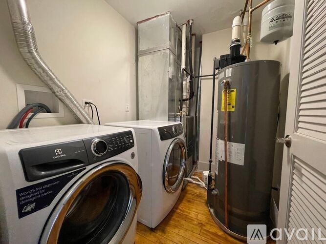 A laundry room with a washer and dryer.