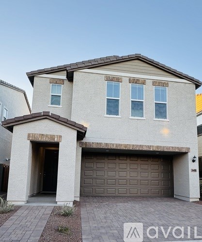 A small, empty room with a brown carpet.