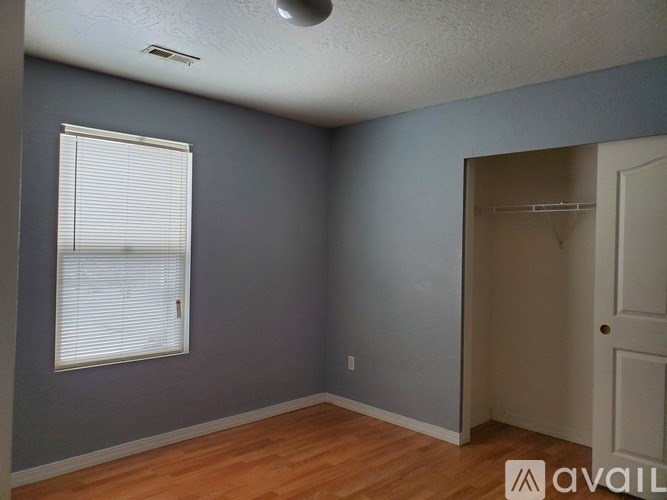 A room with a window and a door.