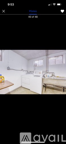 A room with a bed, a desk, and a window.