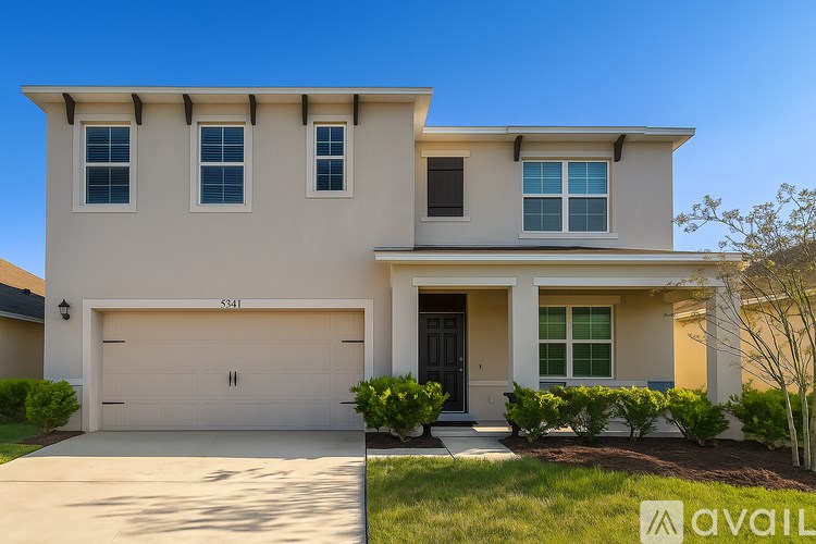 A modern house with a garage and a driveway.