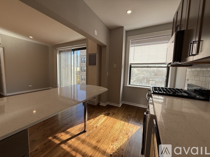A modern kitchen with a large island in the middle.