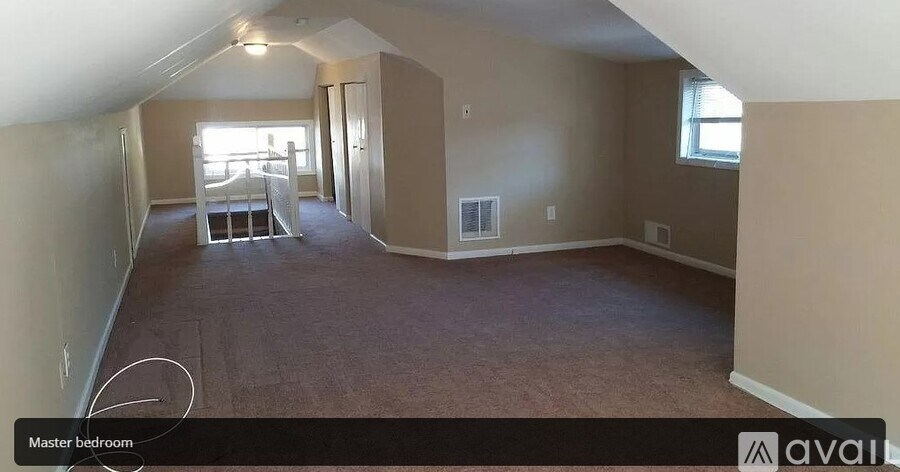 A room with a master bedroom sign on the floor.