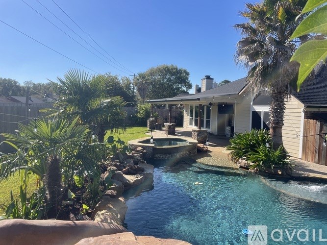 A house with a pool in the backyard.