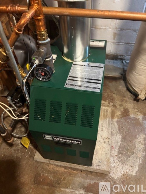 A green Williamson branded unit with a gauge on top.