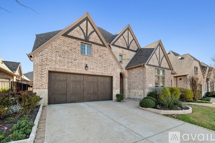 A large house with a garage and a driveway.