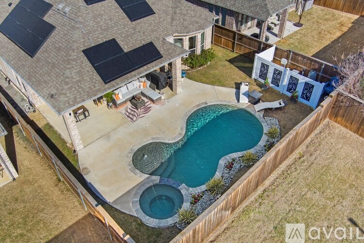 A house with a pool and a hot tub.