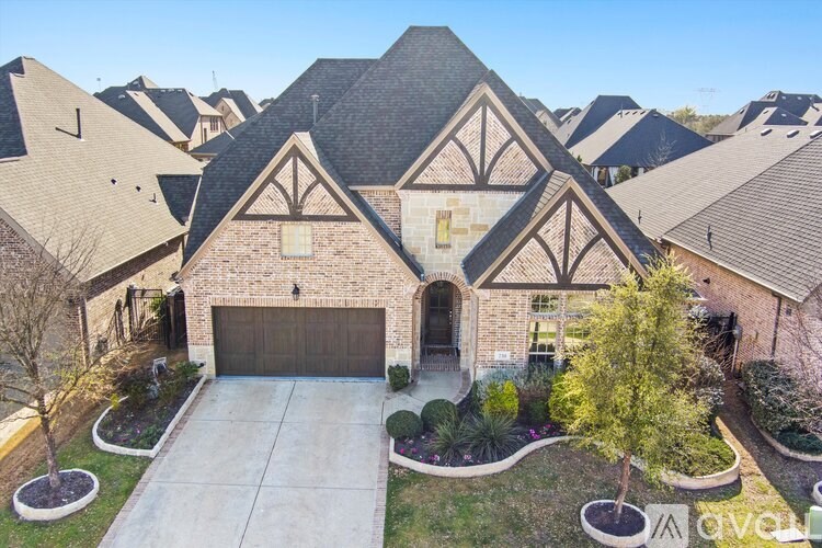 A large house with a garage and a driveway.