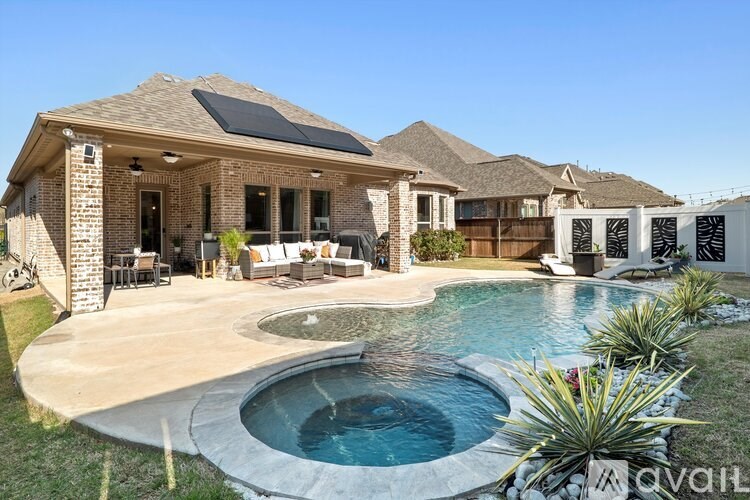 A house with a pool in the backyard.