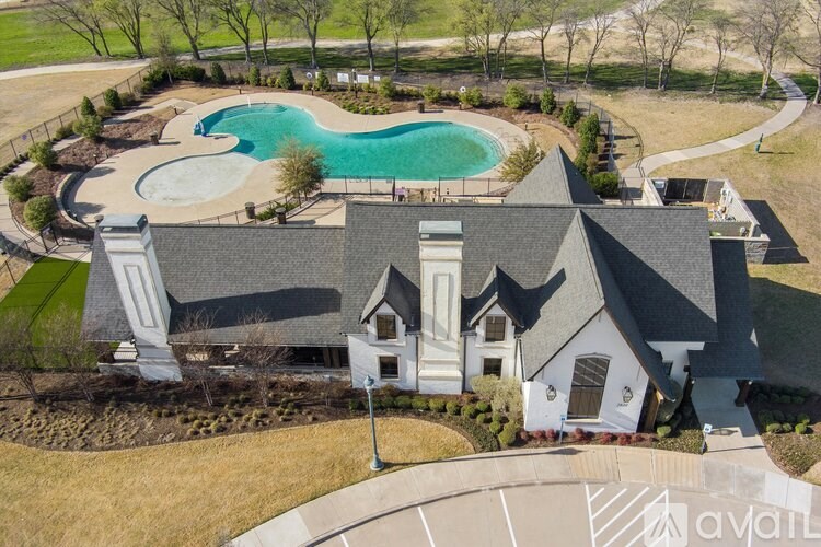 A large house with a pool in the backyard.