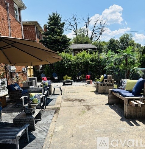 A patio with couches and tables is set up for outdoor seating.