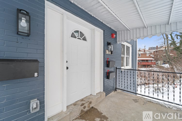 A white door with a glass window is on the left side of the frame.