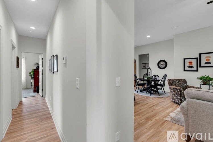 A long hallway with a dining area at the end.
