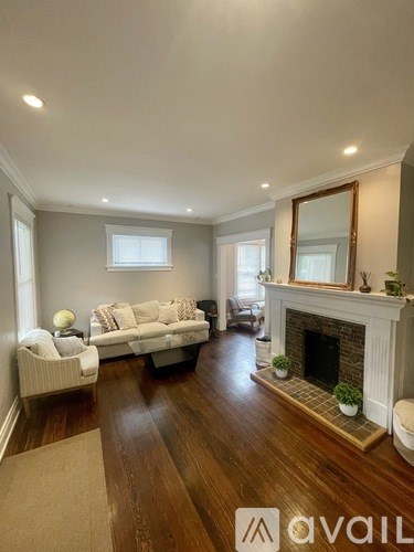 A living room with a fireplace and a couch.