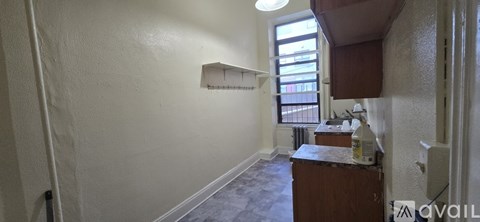 A kitchen area with a window and a sink.