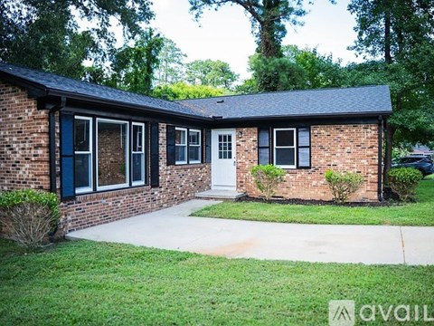 A house with a brick exterior and a white door.