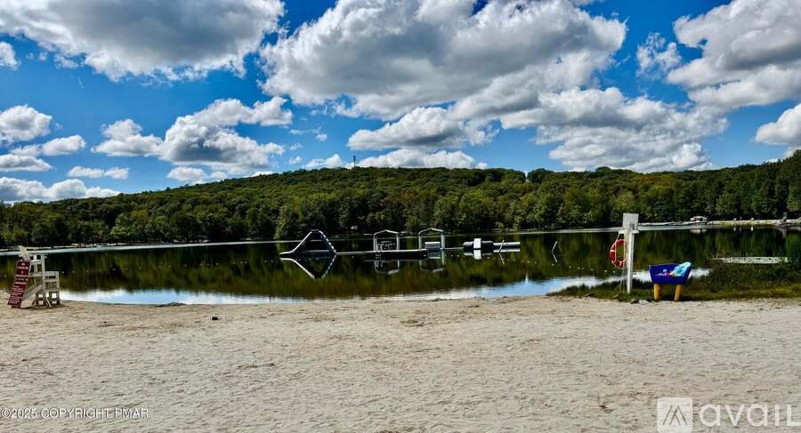 A beach scene with a lifeguard tower and a flag.