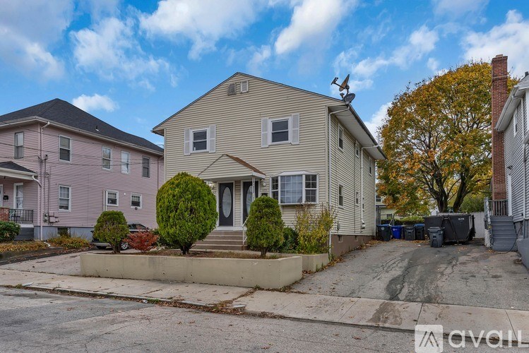 A house with a driveway in front of it.
