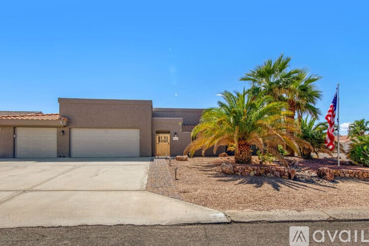 A house with a flag on the front yard.