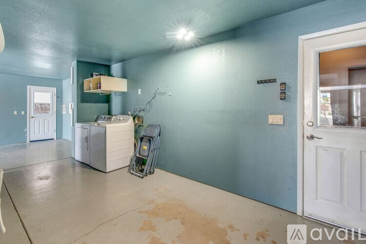 A room with blue walls and a white door.