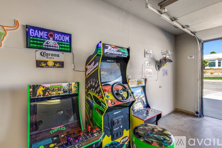 A room with a turtle game and a Corona sign.