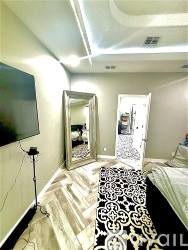 A black and white patterned bench sits in the middle of a room.