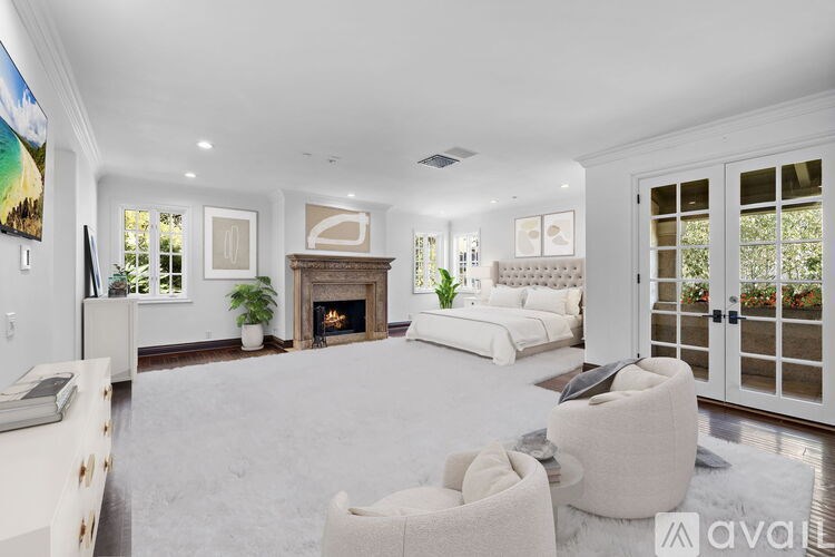 A bathroom with a wooden vanity and a walk-in shower.