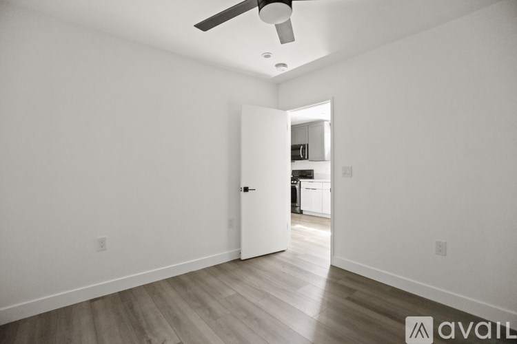 A room with a white door leading to another room.