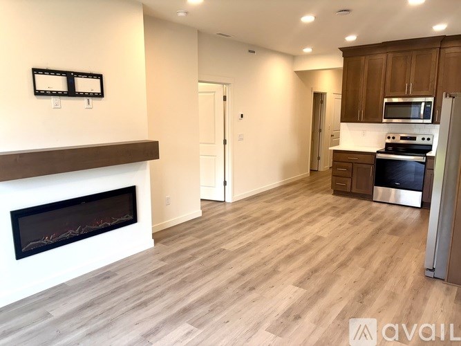 A room with a white door and a white wall.