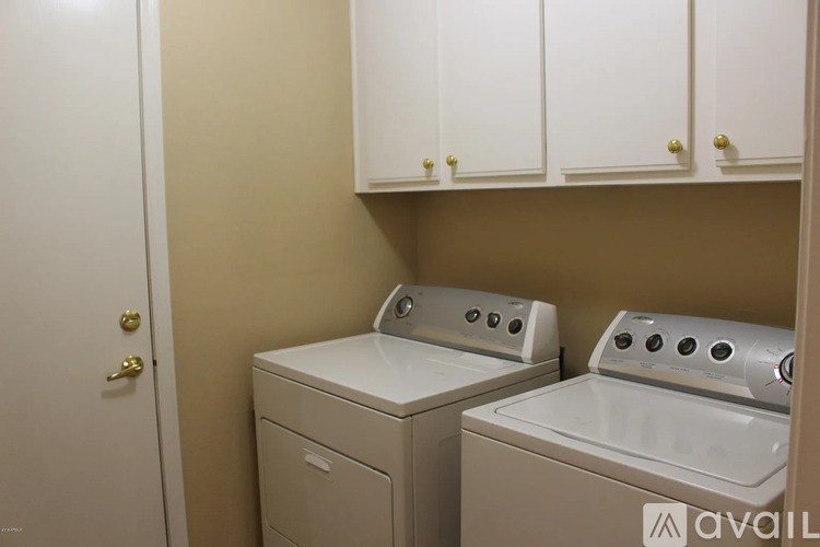 A laundry room with a washer and dryer.