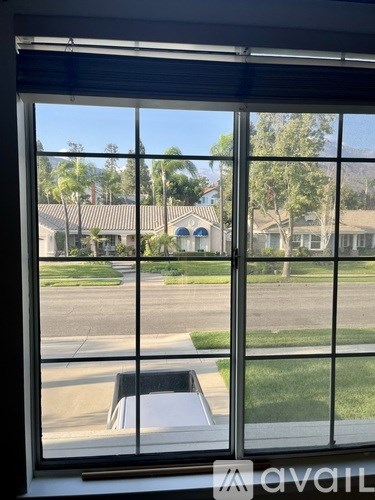 A view from a window looking out at a residential area.