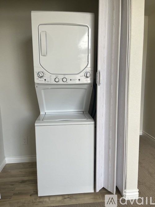 A white washing machine in a room.