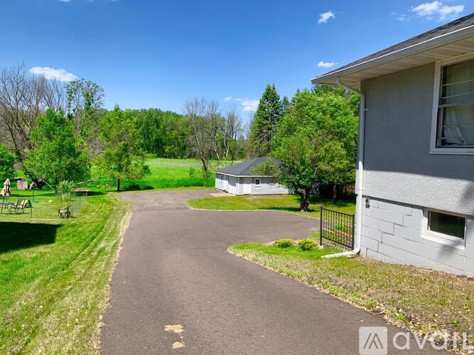 A house with a driveway leading to the front door.