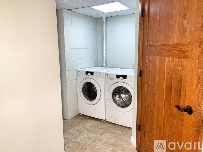 A laundry room with a washer and dryer in it.