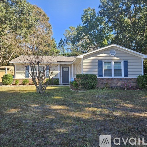 A house with a tree in front of it.