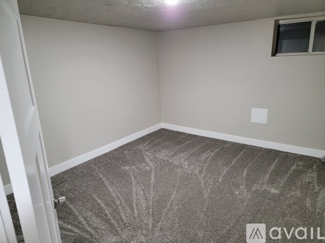 A room with a carpet that has a design on it.