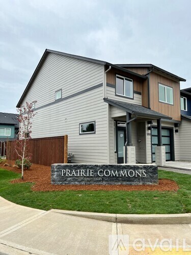 A house with the name "PRAIRIE COMMONS" on the front sign.
