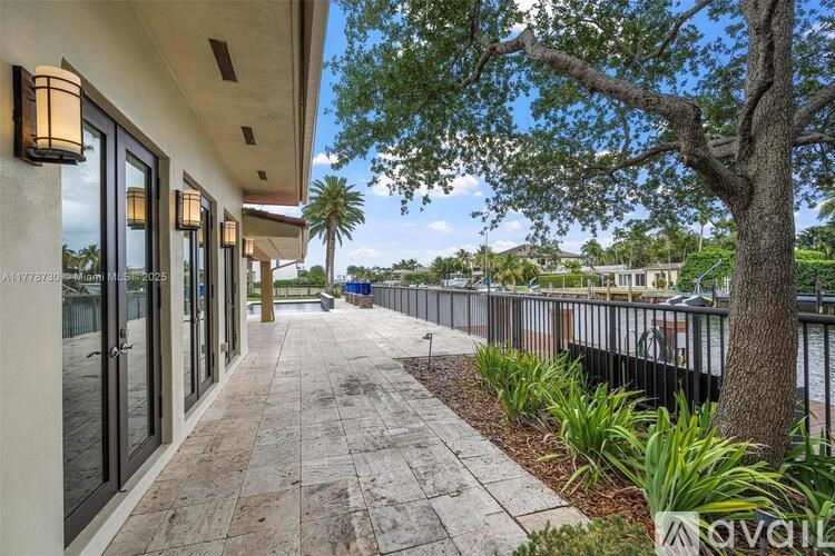A sunny day at the beachfront with a clear blue sky.