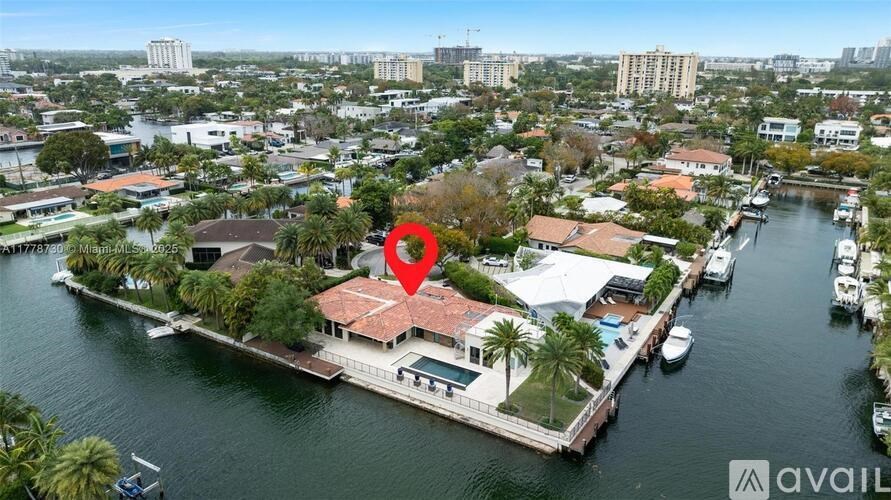 A red marker is placed on a house by the water.