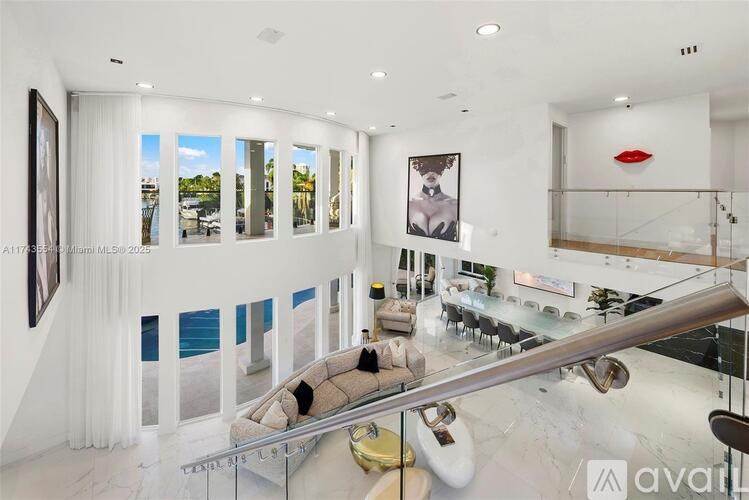 A modern living room with a glass table and a sofa.